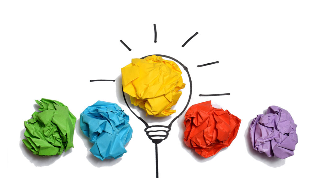 creative-thinking-ideas-innovation-concept-paper-scrap-ball-yellow-colour-with-light-bulb