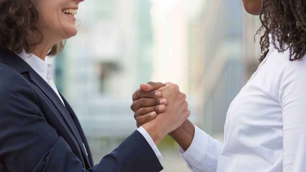 closeup-friendly-handshake-businesswoman